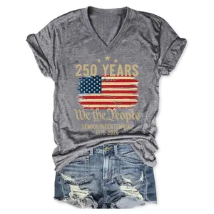 Flat lay of 250th anniversary V-neck grey tee and distressed blue denim shorts set