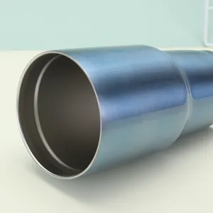 Close-up of blue 30oz stainless steel tumbler with brushed metal texture and wide rim
