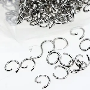 Macro detail of open jump rings in silver finish for DIY jewelry making and crafts
