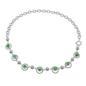Detail of silver titanium necklace featuring green cat eye stone beads and metal spheres