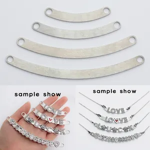 Macro view of DIY curved metal sliders with LOVE charms for bracelets or necklaces