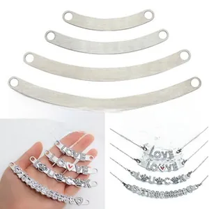 Macro view of DIY curved metal sliders with LOVE charms for bracelets or necklaces