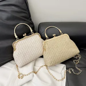 Straw shell clutch bags in beige and gold with metal handles and chain straps