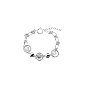 Detail of titanium necklace featuring cat eye beads and polished silver chain link