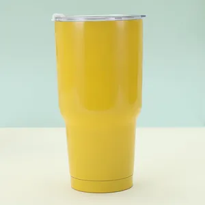Close-up of lemon yellow 30oz stainless steel tumbler with tapered bottom for car holder