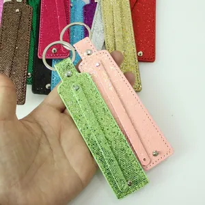 Close-up of colorful glitter sequin keychains with metal rings for DIY accessories