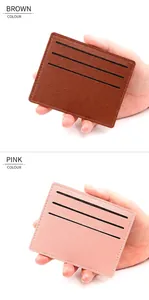Close-up of slim brown and pink leather card holders with fine lychee grain texture