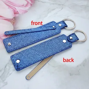 Detailed front and back views of a blue sequin keychain with silver ring and snap button
