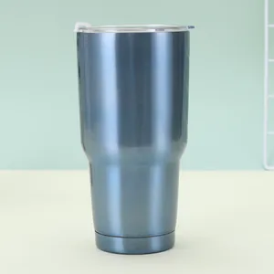 Detail view of 30oz blue stainless steel travel mug with lid and slide switch