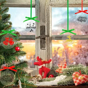Clear acrylic Christmas ornament with Merry Christmas print and festive ribbons