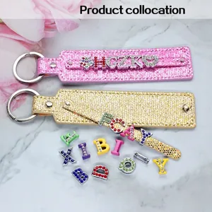 DIY sequin keychain set with sparkle letters and heart charms in pink and gold finish