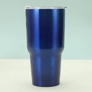 Detail of 30oz dark blue insulated tumbler with tapered base and clear slider lid