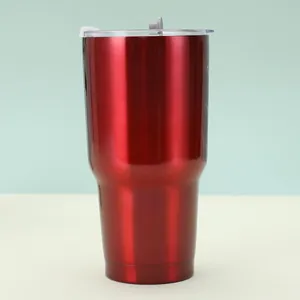Detail view of deep red metallic finish 30oz tumbler with clear lid and tapered base