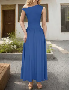 Detail of royal blue one shoulder maxi dress with cinched waist and pleated design