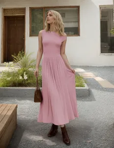 Detail of soft pink sleeveless maxi dress with large hem and minimalist summer style
