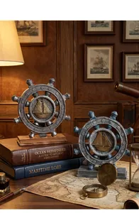 Macro shot of vintage nautical ship wheel ornaments with sailboat relief and base