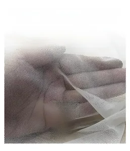 Macro detail of breathable nylon mesh fabric texture showing its transparent structure