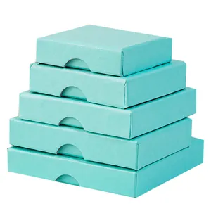 Stack of five Tiffany blue jewelry gift boxes featuring ergonomic finger notch cutouts