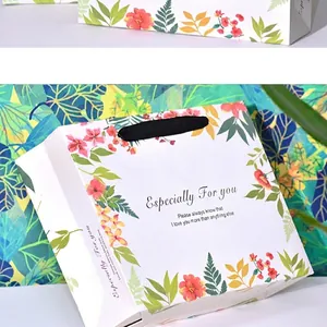 Floral paper gift bag with silk handles and Especially For You printed text for shopping