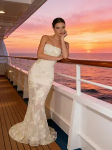 Elegant ivory strapless mermaid evening dress with floral lace embroidery and train