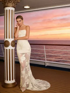 Elegant white strapless mermaid evening gown with floral embroidery and mesh trail