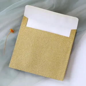 Macro detail of high-end rose gold glitter square envelope with clean white lining