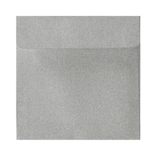 Macro shot showing the sparkling silver glitter texture on square paper envelope