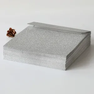 Detailed view of silver glitter envelopes stacked with premium textured matte finish