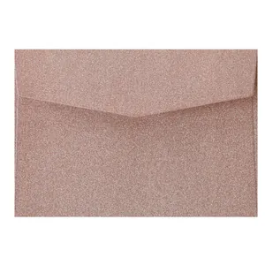 Detail of rose gold glitter texture and V-shaped flap on square self-adhesive envelope