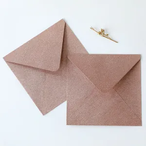Close-up of rose gold glitter envelopes with a premium frosted shimmer texture for invitations