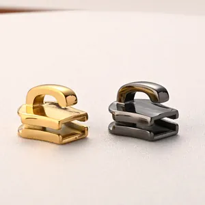 Macro view of gold and gunmetal 316 stainless steel zipper pullers for bags