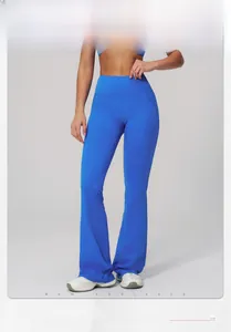 Macro detail of high-waist electric blue flare yoga pants with premium elastic fabric