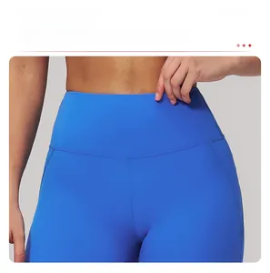 Detail of high waisted compression yoga pants in royal blue with seamless stitching