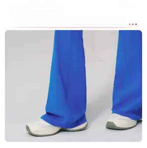 Detail of blue high-waisted flared yoga pants with elongated hem and athletic fit