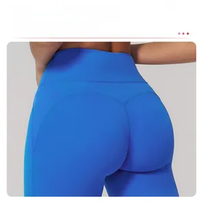 Close-up of high-waist blue yoga pants showing butt-lifting seams and flatlock stitching