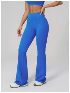 Close-up of bright blue high-waisted flared yoga pants and matching sports vest top