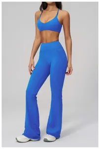 Detail view of royal blue high waist flared yoga pants and matching V-neck sports bra