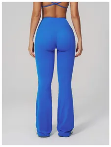 Rear view of high-waisted blue flare yoga leggings showing push-up lifting effect