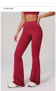 Close-up of high-waisted flared yoga pants in vermilion red with premium stretchy fabric
