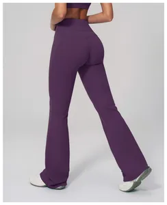 Macro view of high-waist yoga pants in deep purple showing butt lifting seam and flared hem
