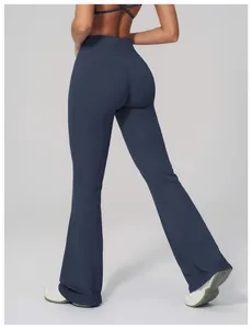 Rear view of high waist navy flare leggings featuring a flattering V-shaped seam