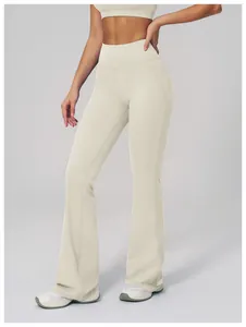 Close-up of high-waist flared yoga pants featuring reinforced stitching and matte fabric
