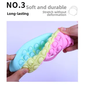 Close-up of flexible rainbow silicone heart bag showing its durable and stretchy texture