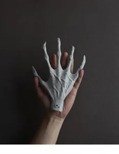 Macro detail of Halloween giant skeleton hand prop showing realistic muscle texture