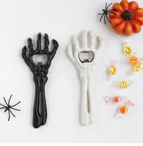 Detail of skull hand bottle openers with bone texture for Halloween decoration
