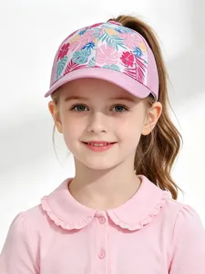 Detailed shot of pink kids baseball cap featuring tropical pineapple and floral prints