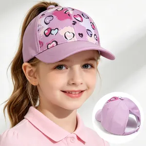 Kids lavender ponytail baseball cap with colorful heart patterns and rear opening