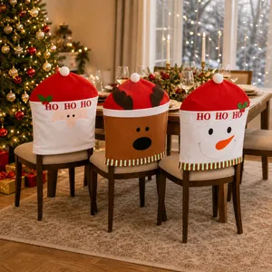 Close-up of Santa and Snowman themed chair covers with festive HO HO HO embroidery