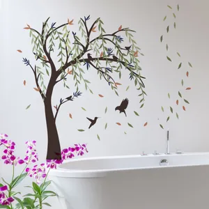 Detail of self-adhesive wall decal featuring a lush weeping willow tree and flying birds