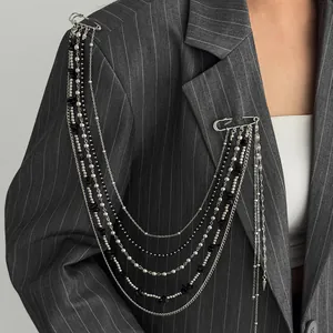 Punk silver chain brooch with black stone beads and double pin hanging on suit